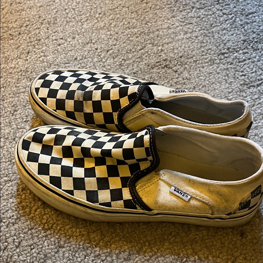 Woman’s 7.5 Black and White Checkered Slip-On Vans